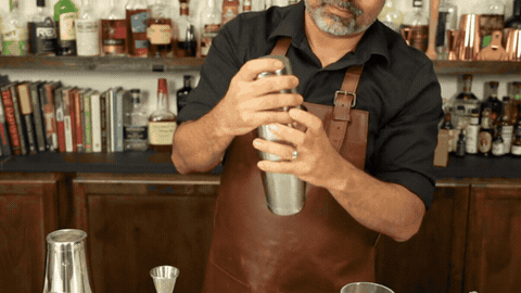 Opening a Boston shaker by striking the seam with the palm to release the seal